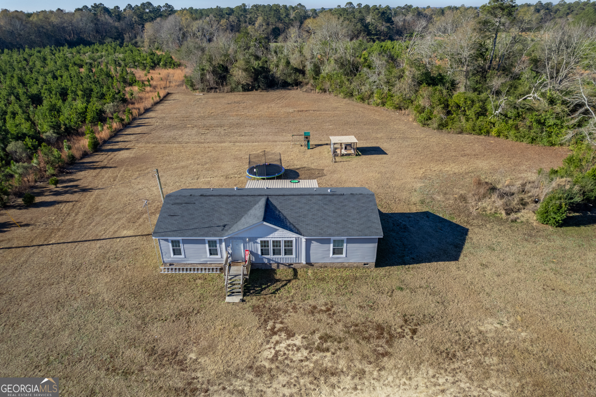 12546 Highway 1 Wrens, GA 30833 - Photo 5 of 41 an aerial view of a house with a yard