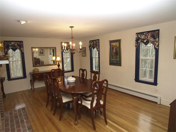 46 Frye Road Bolton, MA 01740 - Photo 8 of 21 a view of a a dining room with furniture window and wooden floor