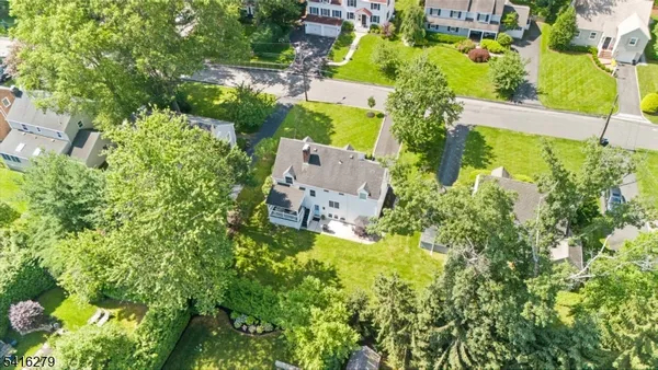 an aerial view of houses with yard