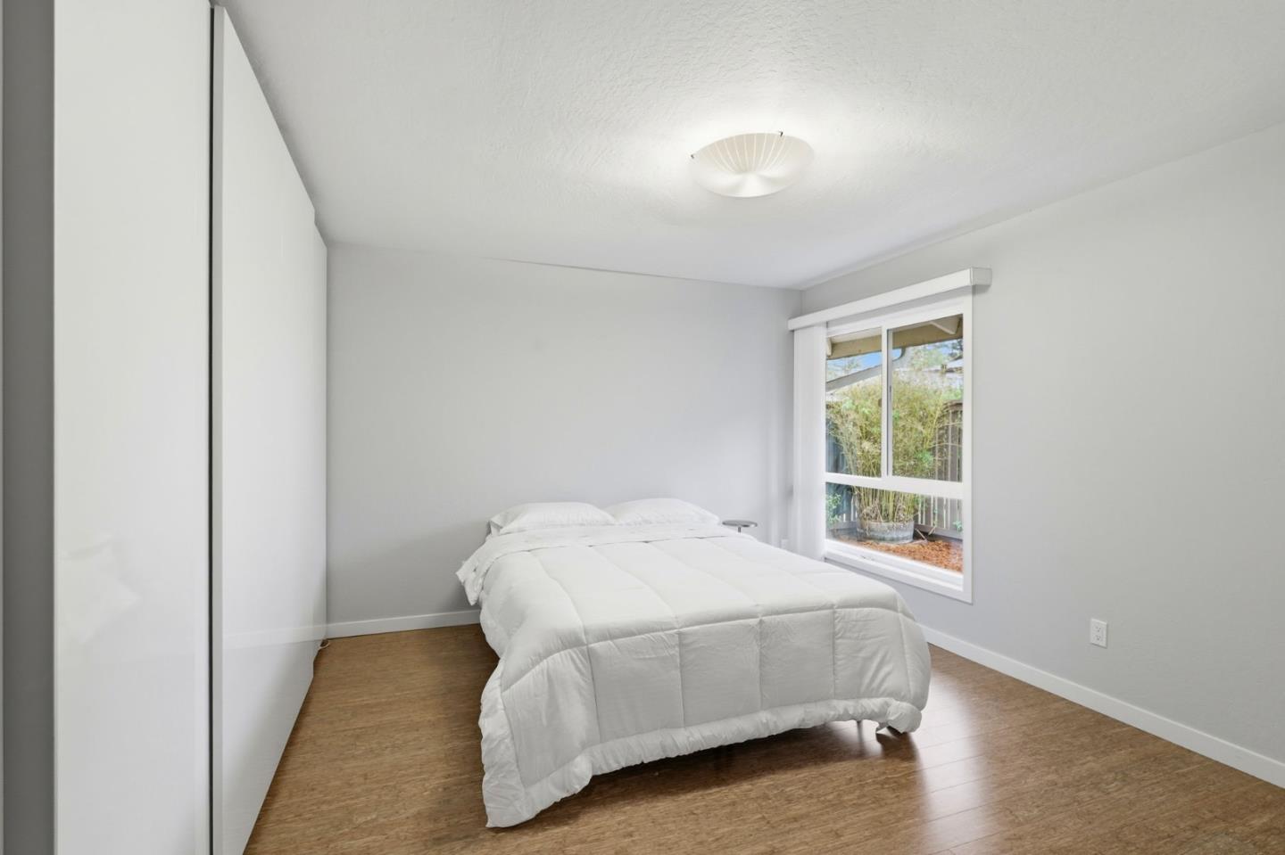 152 Castillion Terrace Santa Cruz, CA 95060 - Photo 14 of 37 a bed sitting in a bedroom next to a window