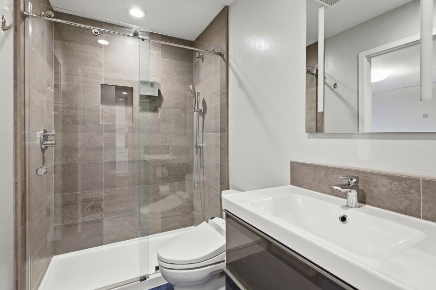 152 Castillion Terrace Santa Cruz, CA 95060 - Photo 16 of 37 a bathroom with a sink toilet and shower