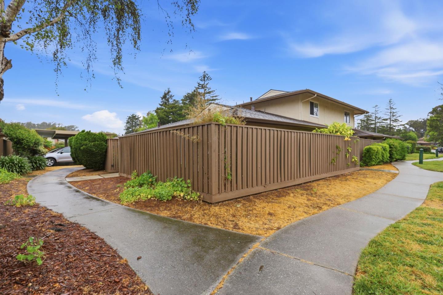 152 Castillion Terrace Santa Cruz, CA 95060 - Photo 19 of 37 a view of a backyard with plants and a fence
