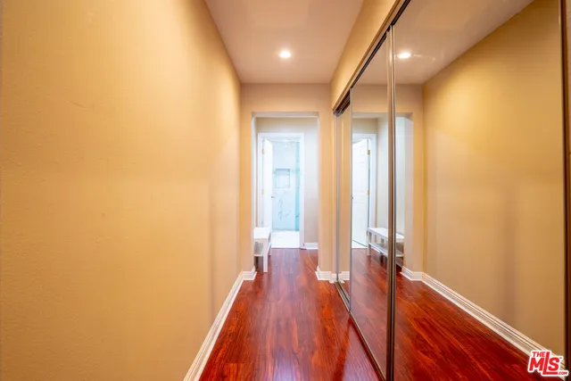 a view of a room with wooden floor and staircase