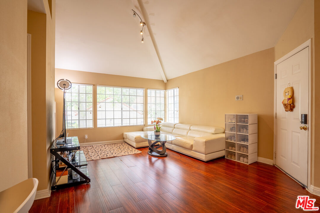 4240 Lost Hills Road, Unit 503 Agoura Hills, CA 91301 - Photo 4 of 18 a living room with furniture and a wooden floor