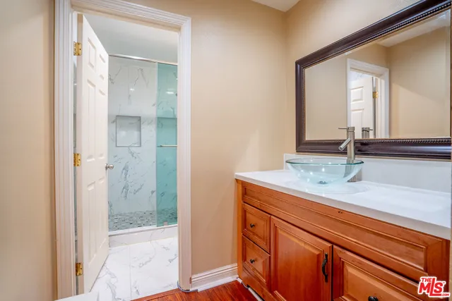 a bathroom with a sink and a mirror