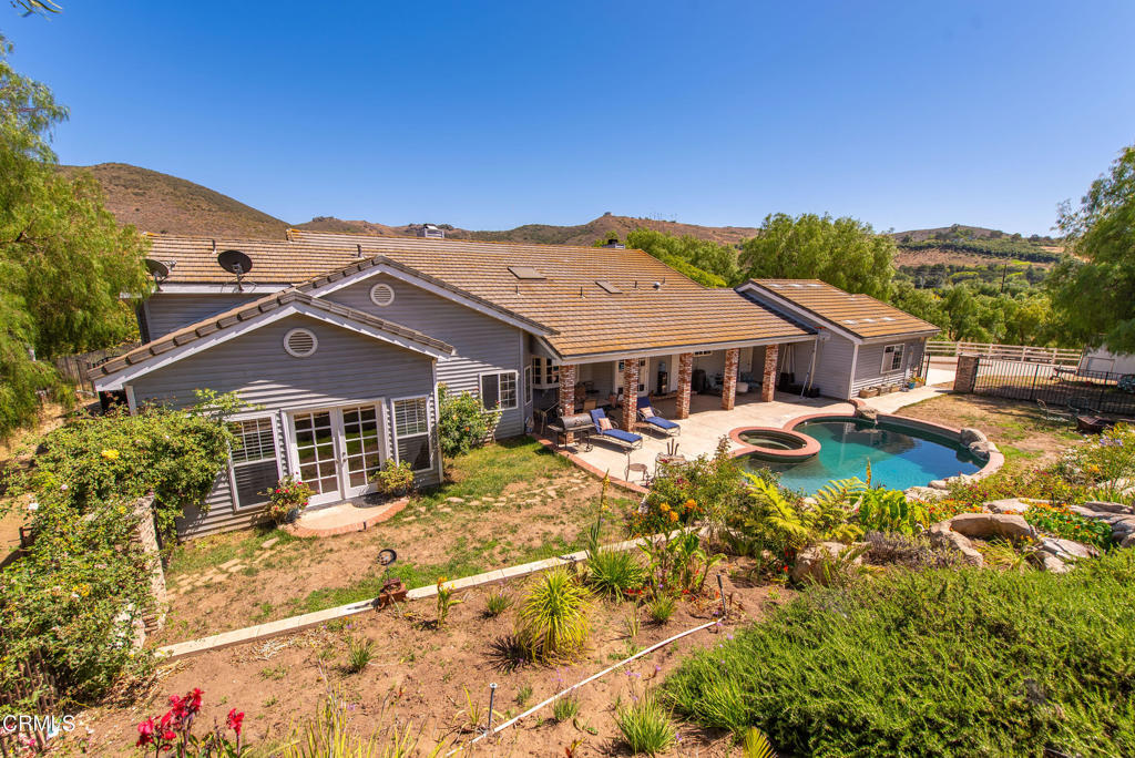 4850 North Moorpark Road Thousand Oaks, CA 93021 - Photo 12 of 54 a house with swimming pool in front of it
