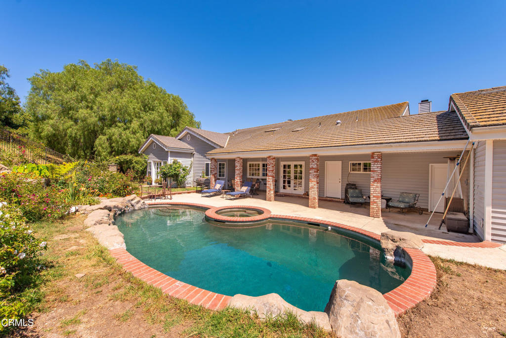 4850 North Moorpark Road Thousand Oaks, CA 93021 - Photo 14 of 54 a view of a house with swimming pool and sitting area