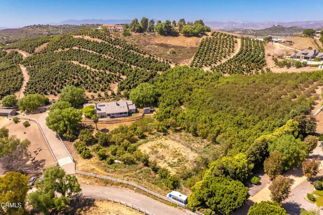 a view of swimming pool with chairs in patio