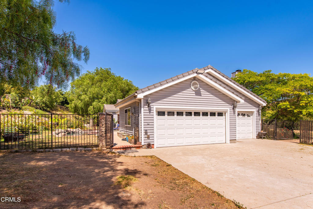 4850 North Moorpark Road Thousand Oaks, CA 93021 - Photo 29 of 54 a view of house and outdoor space with wooden fence