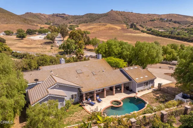 an aerial view of residential houses with outdoor space