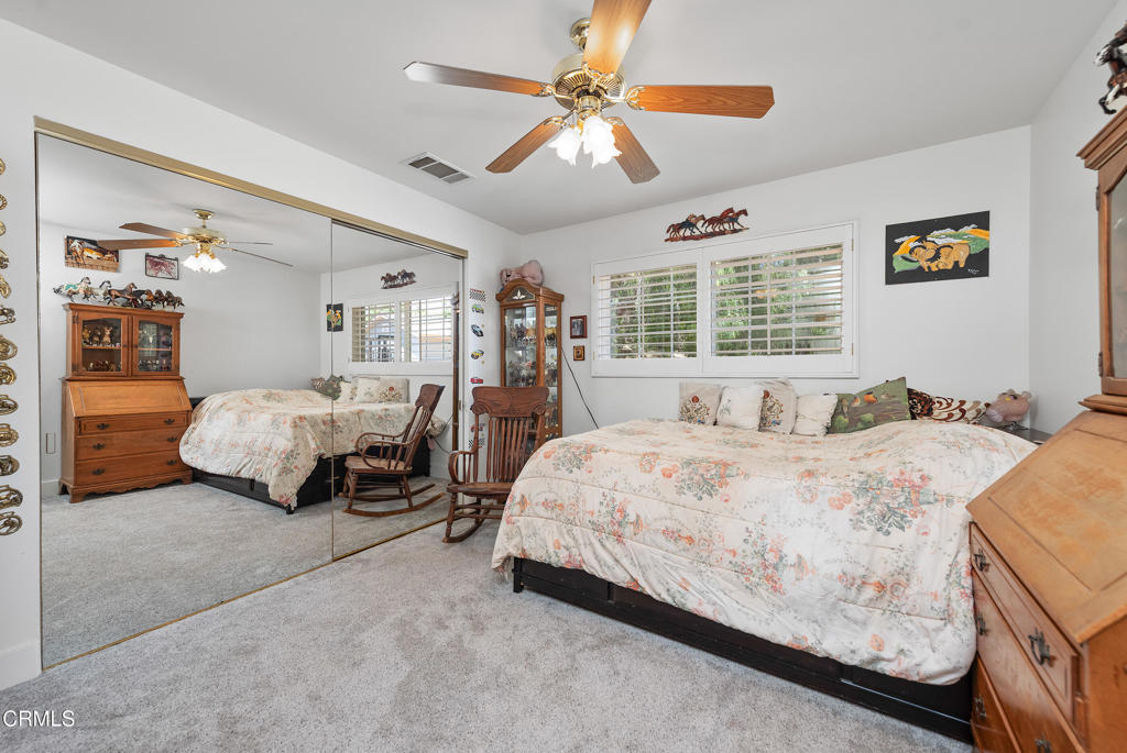 4850 North Moorpark Road Thousand Oaks, CA 93021 - Photo 53 of 54 a spacious bedroom with a bed and a chandelier