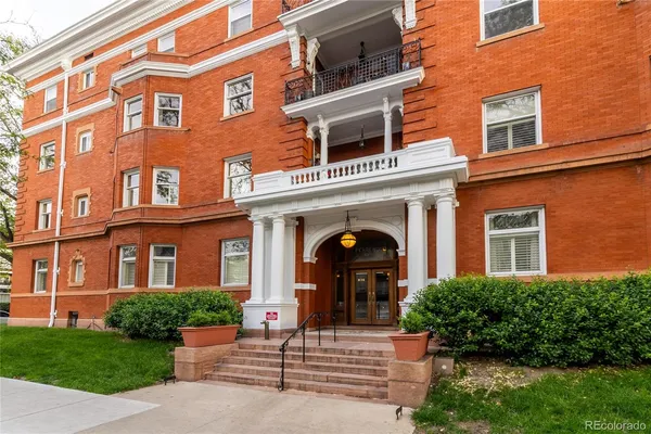 front view of a building with a yard