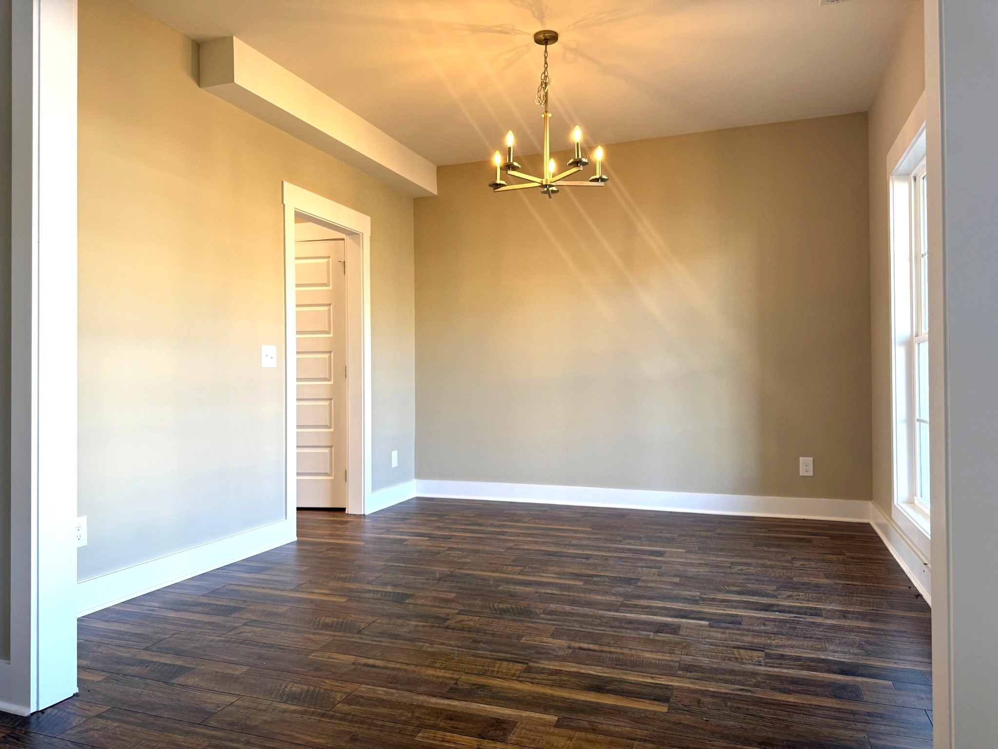 1172 Rimrock Road Smyrna, TN 37167 - Photo 4 of 10 an empty room with wooden floor and windows