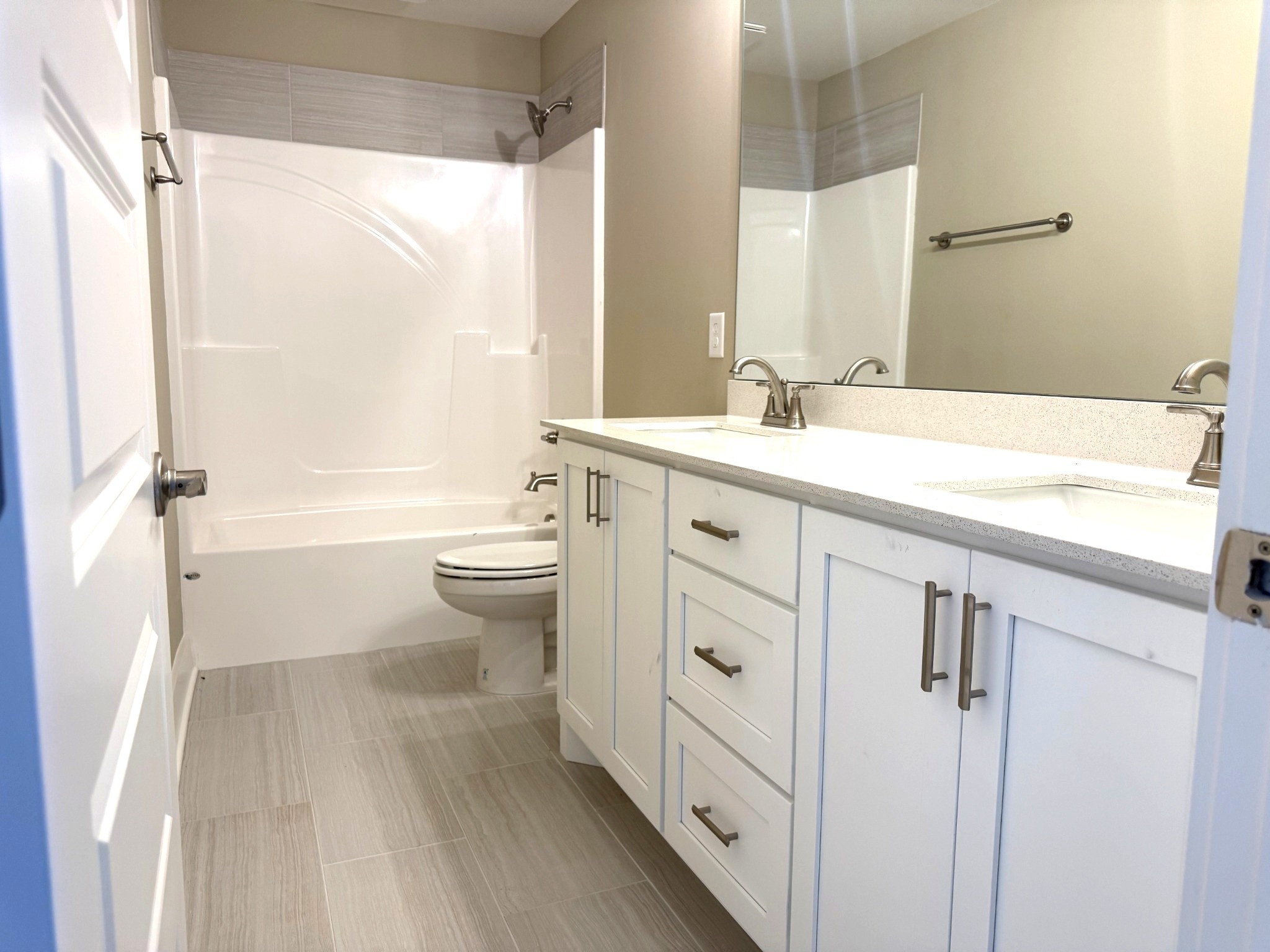 1172 Rimrock Road Smyrna, TN 37167 - Photo 5 of 10 a bathroom with a sink a toilet a mirror and shower