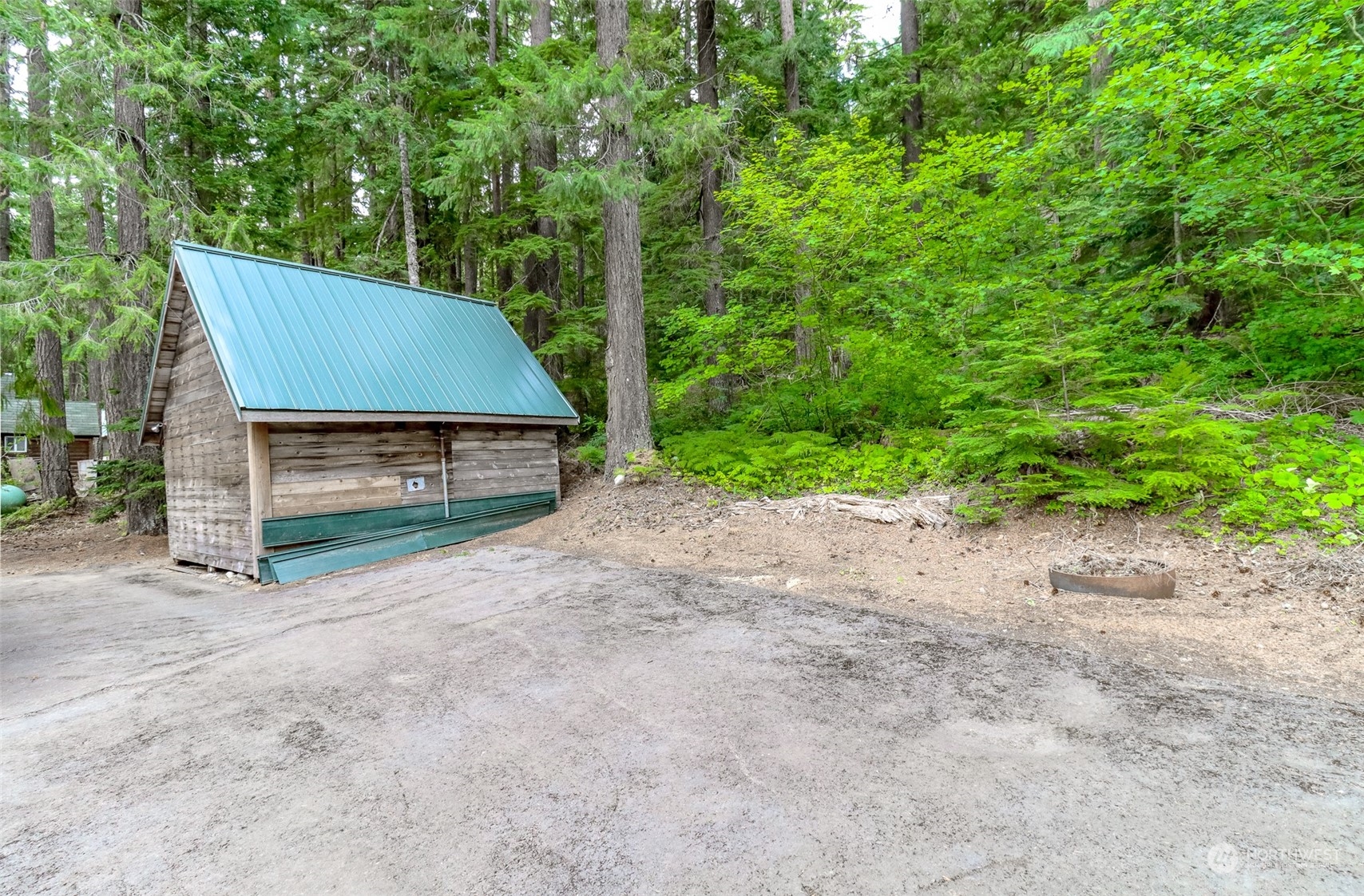 4061 Fs Road Easton, WA 98925 - Photo 23 of 26 a backyard of a house with large trees and plants