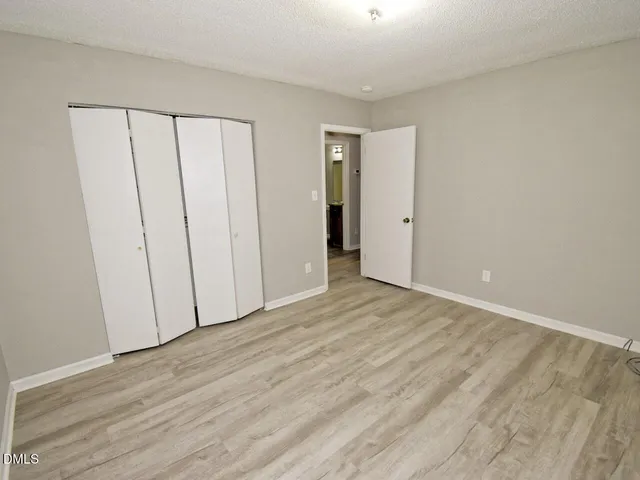 a view of a livingroom with wooden floor