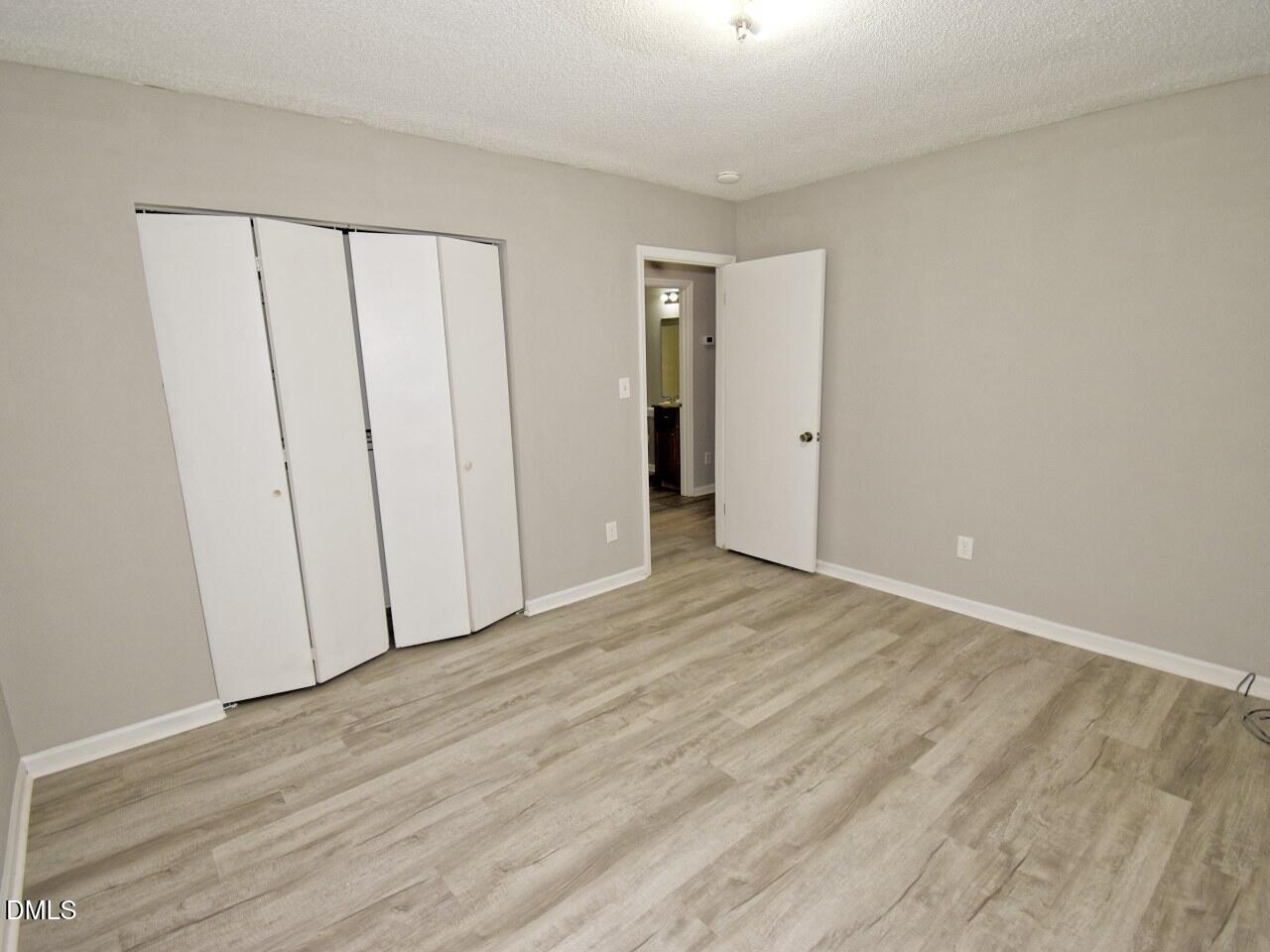 841 Barringer Drive, Unit A Raleigh, NC 27606 - Photo 13 of 23 a view of a livingroom with wooden floor