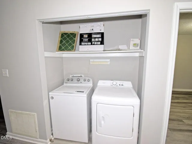 a utility room with dryer and washer