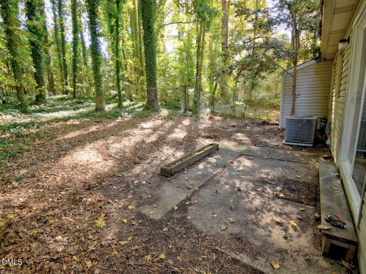 841 Barringer Drive, Unit A Raleigh, NC 27606 - Photo 20 of 23 a backyard of a house with lots of green space