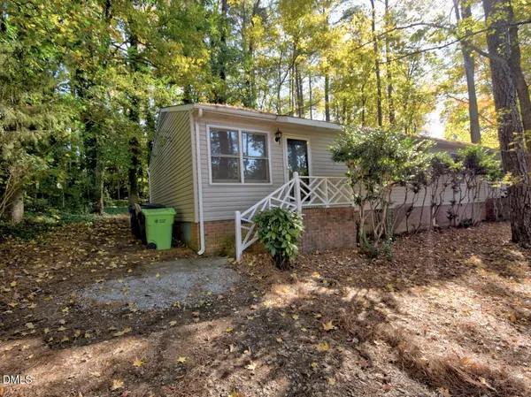 a view of a house with a yard and plants