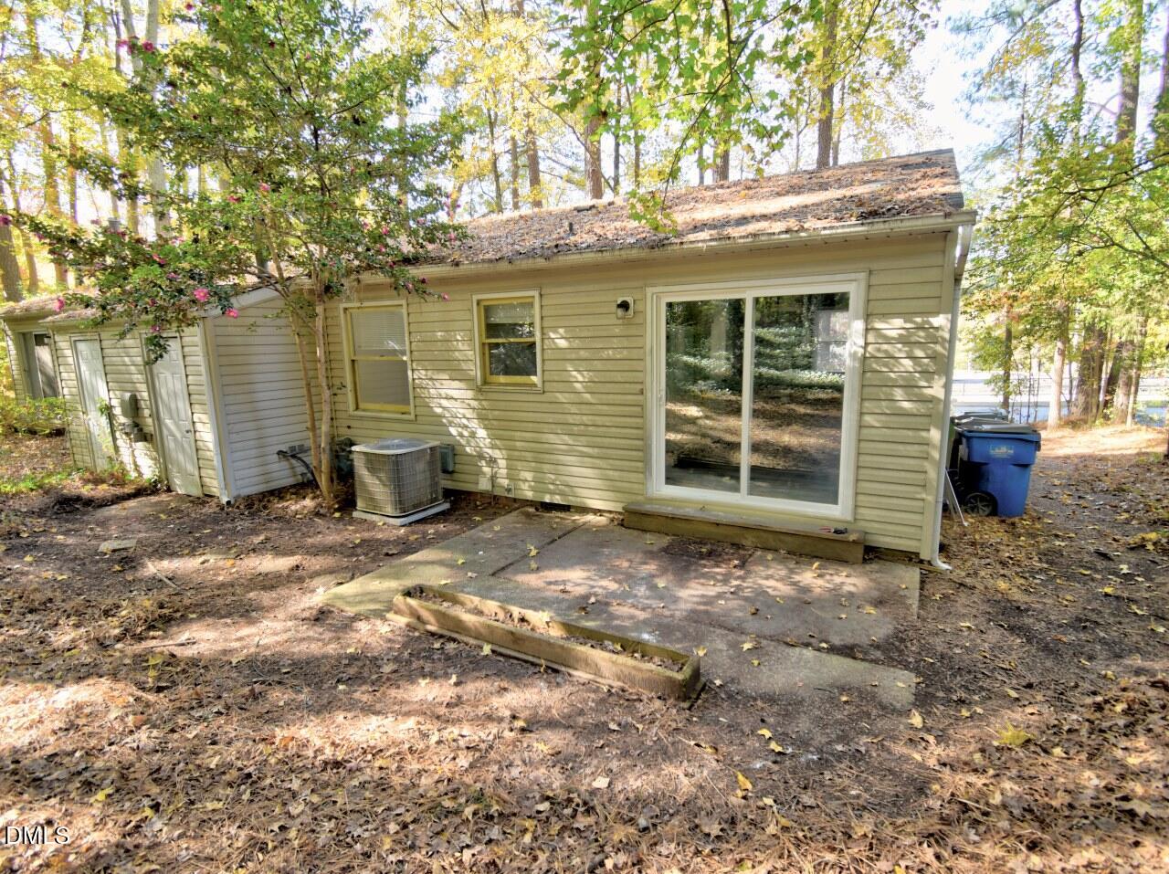 841 Barringer Drive, Unit A Raleigh, NC 27606 - Photo 21 of 23 a view of a house with a yard and tree