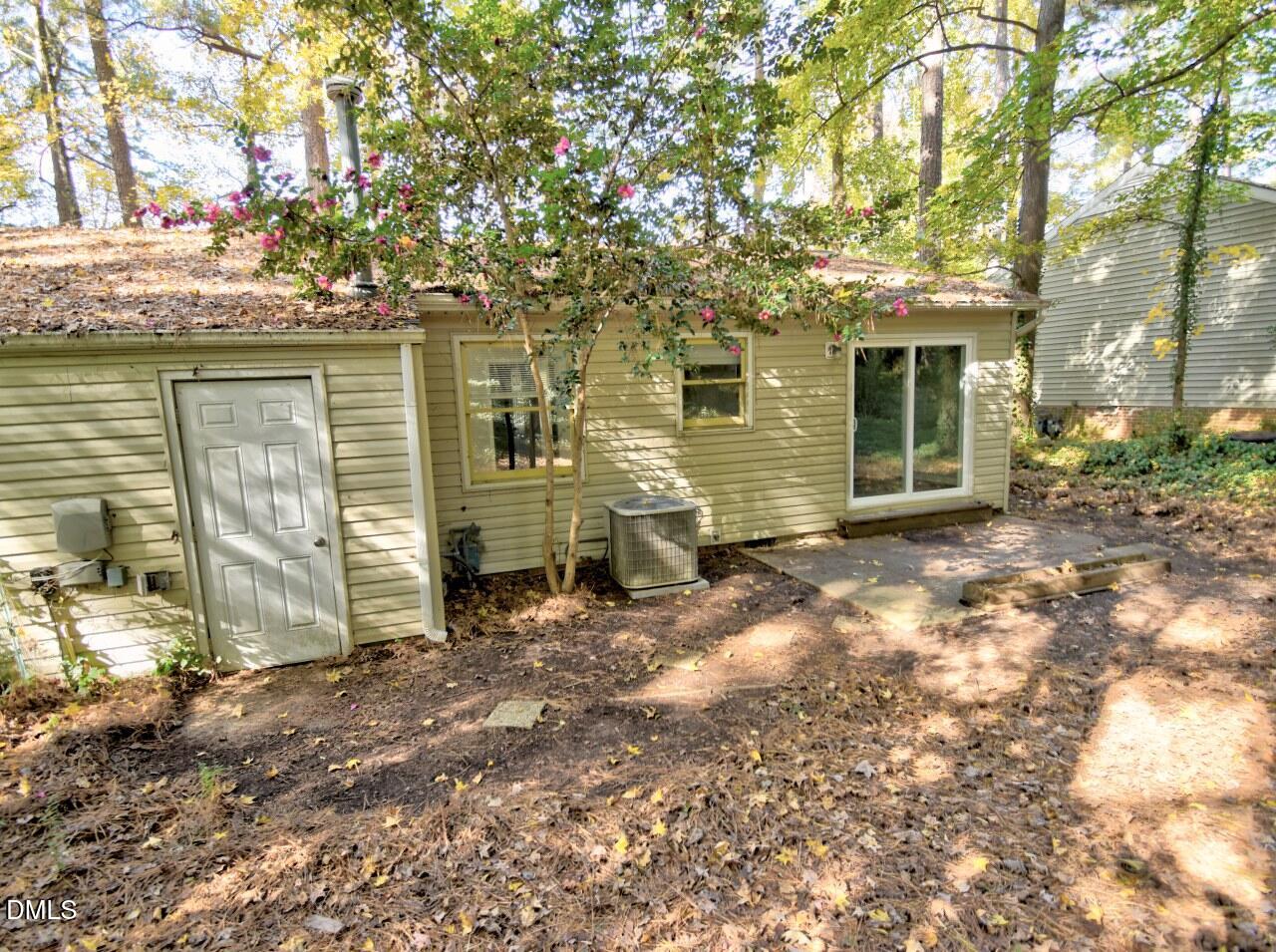 841 Barringer Drive, Unit A Raleigh, NC 27606 - Photo 22 of 23 a view of a house with a large tree