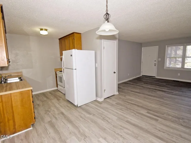 a view of a storage & utility room with wooden floor