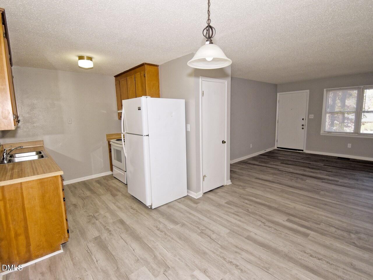 841 Barringer Drive, Unit A Raleigh, NC 27606 - Photo 8 of 23 a view of a storage & utility room with wooden floor