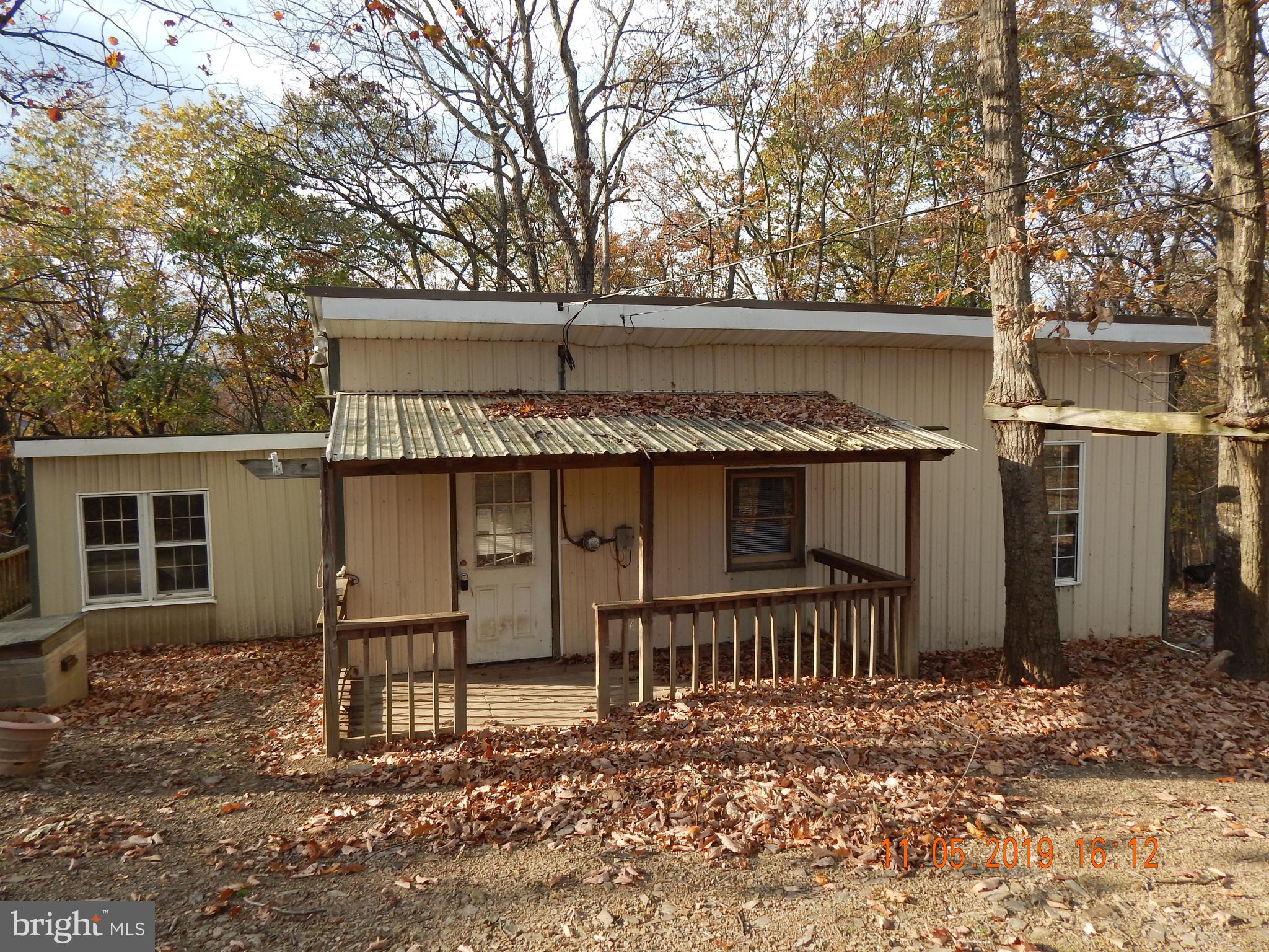 4040 Wv Route Berkeley Springs, WV 25411 - Photo 1 of 28 Cute cabin in the woods.