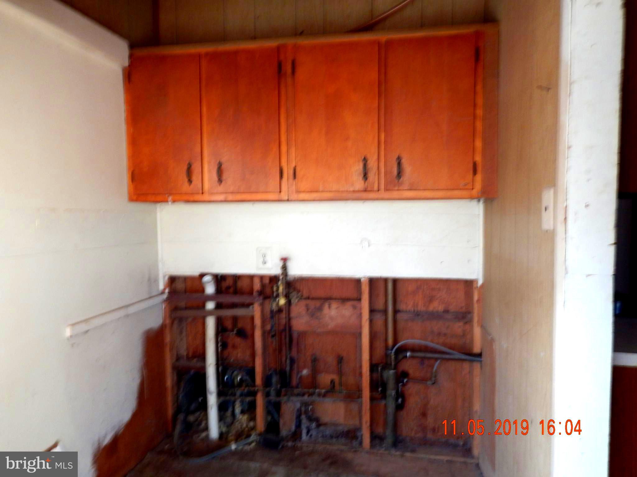 4040 Wv Route Berkeley Springs, WV 25411 - Photo 2 of 28 Laundry room at the cabin entrance.