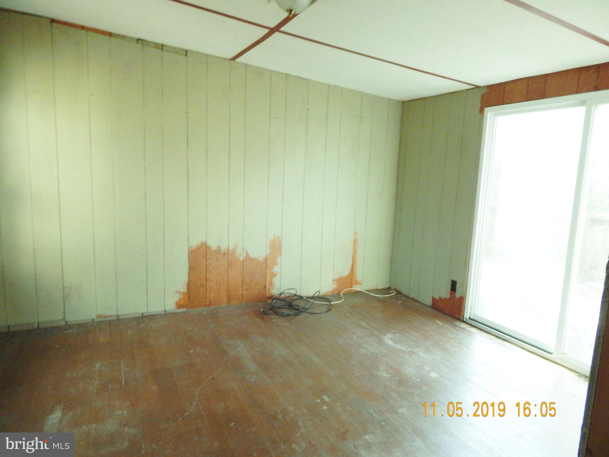 4040 Wv Route Berkeley Springs, WV 25411 - Photo 4 of 28 Used as bedroom #2 with sliding doors to the deck.