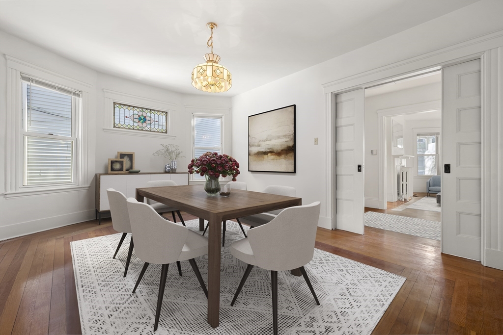 27 Willis Street Boston, MA 02125 - Photo 3 of 9 a view of a dining room with furniture and wooden floor