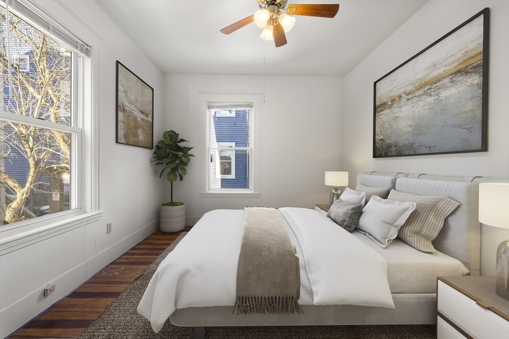 27 Willis Street Boston, MA 02125 - Photo 5 of 9 a bedroom with a large bed and a window