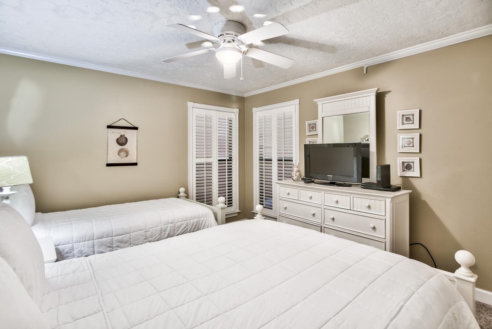 500 Gulf Shore Drive, Unit 119B Destin, FL 32541 - Photo 16 of 35 a bedroom with a large bed and a flat screen tv