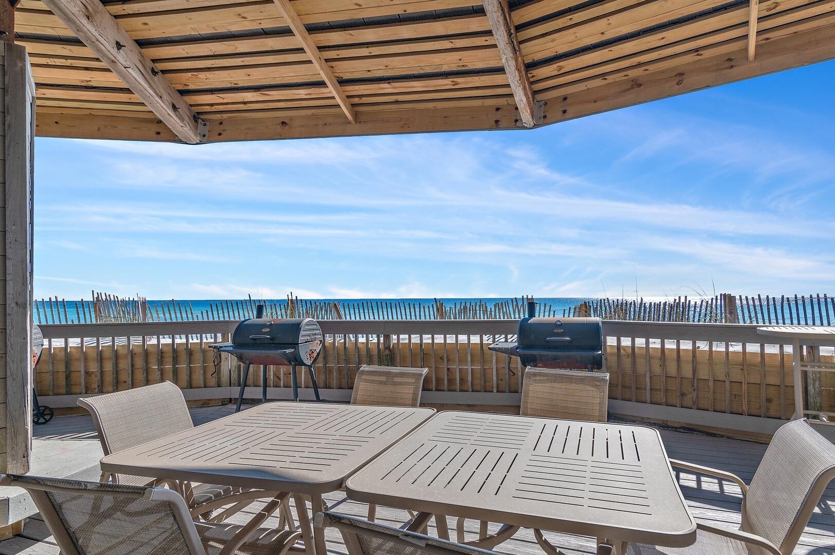 500 Gulf Shore Drive, Unit 119B Destin, FL 32541 - Photo 21 of 35 a view of a balcony with wooden floor chairs and wooden floor