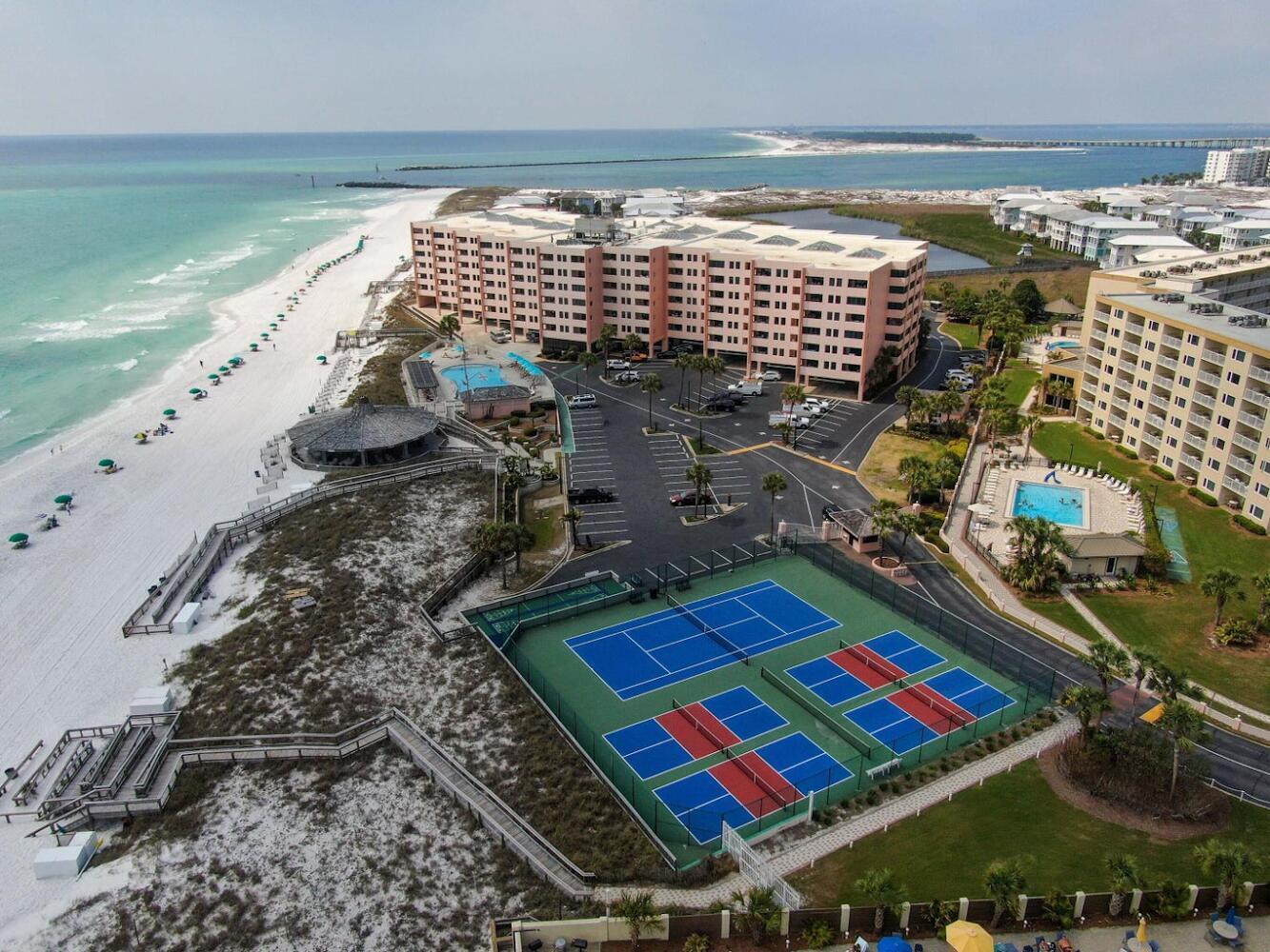 500 Gulf Shore Drive, Unit 119B Destin, FL 32541 - Photo 30 of 35 a picture of floor to ceiling window next to a yard