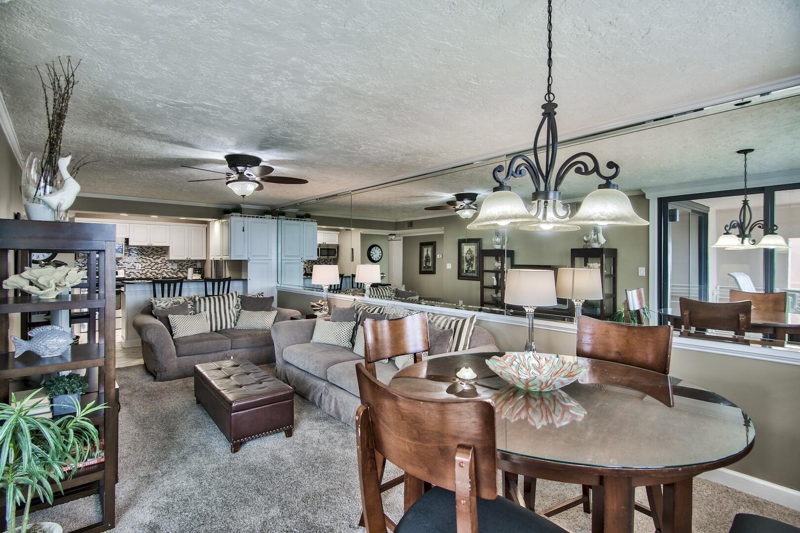 500 Gulf Shore Drive, Unit 119B Destin, FL 32541 - Photo 9 of 35 a living room with lots of furniture and a chandelier