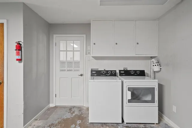a utility room with washer and dryer