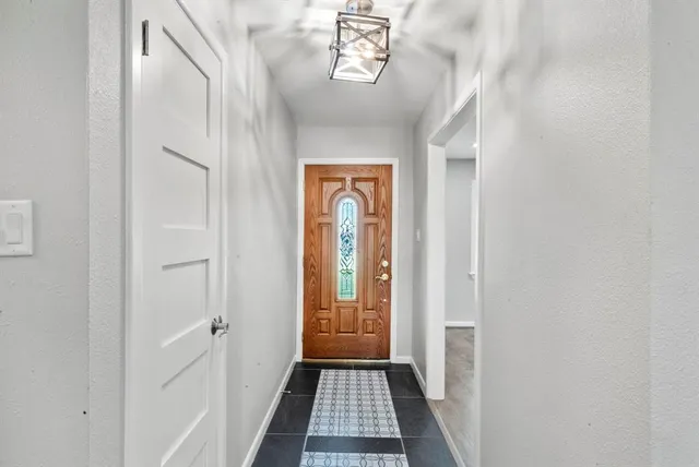 a view of a hallway with windows
