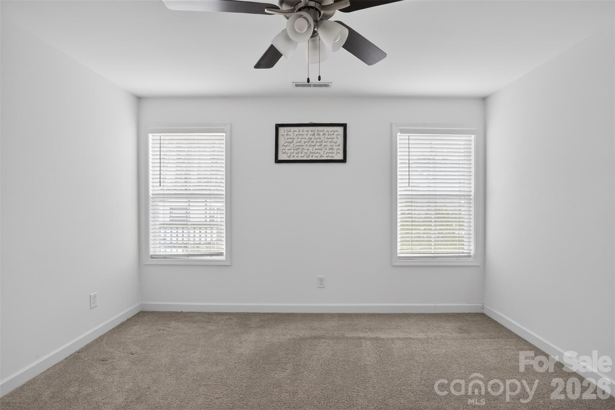 1526 Shepard Street Kannapolis, NC 28083 - Photo 19 of 40 an empty room with windows and fan
