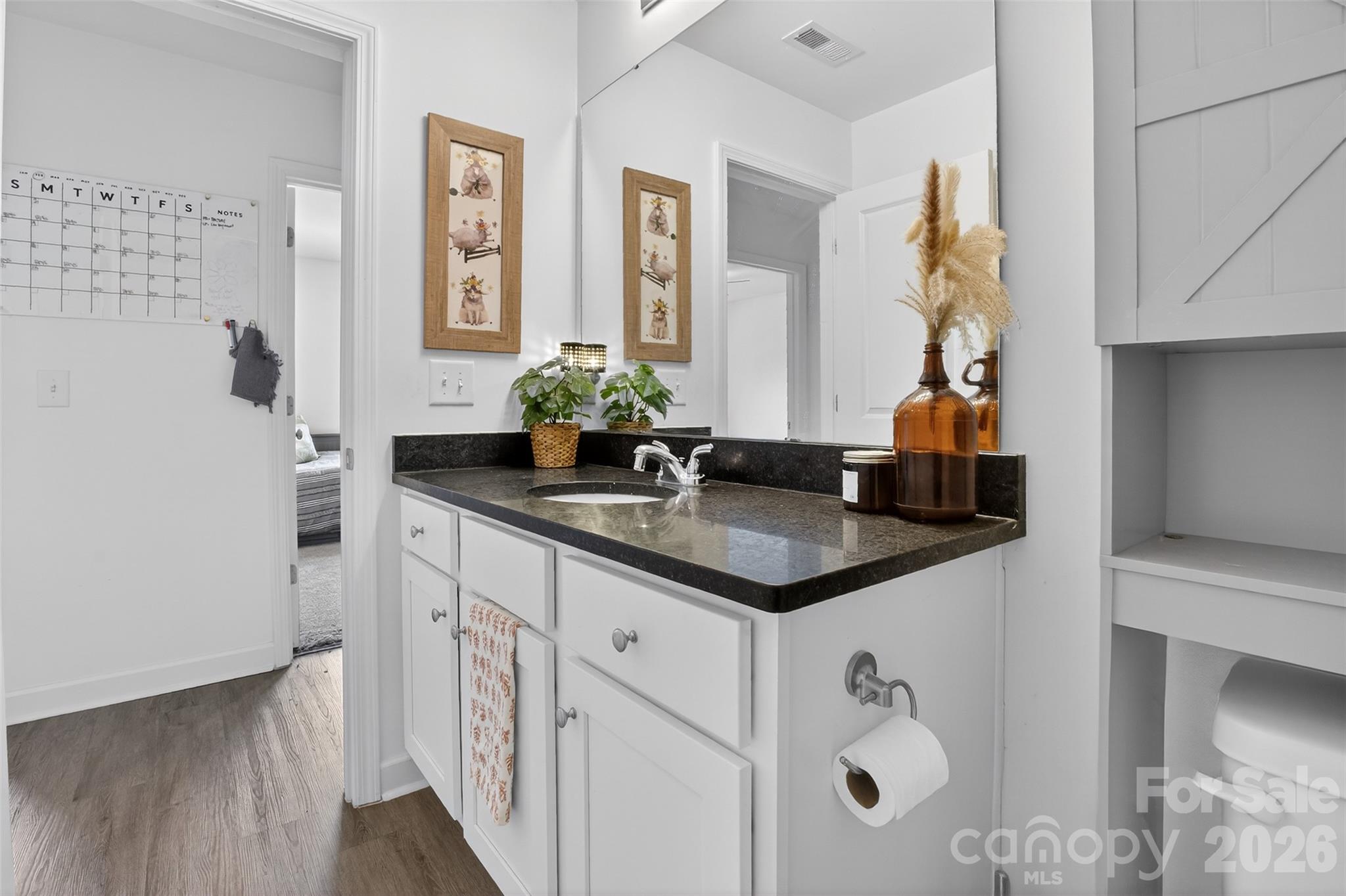 1526 Shepard Street Kannapolis, NC 28083 - Photo 28 of 40 a bathroom with a sink and a mirror