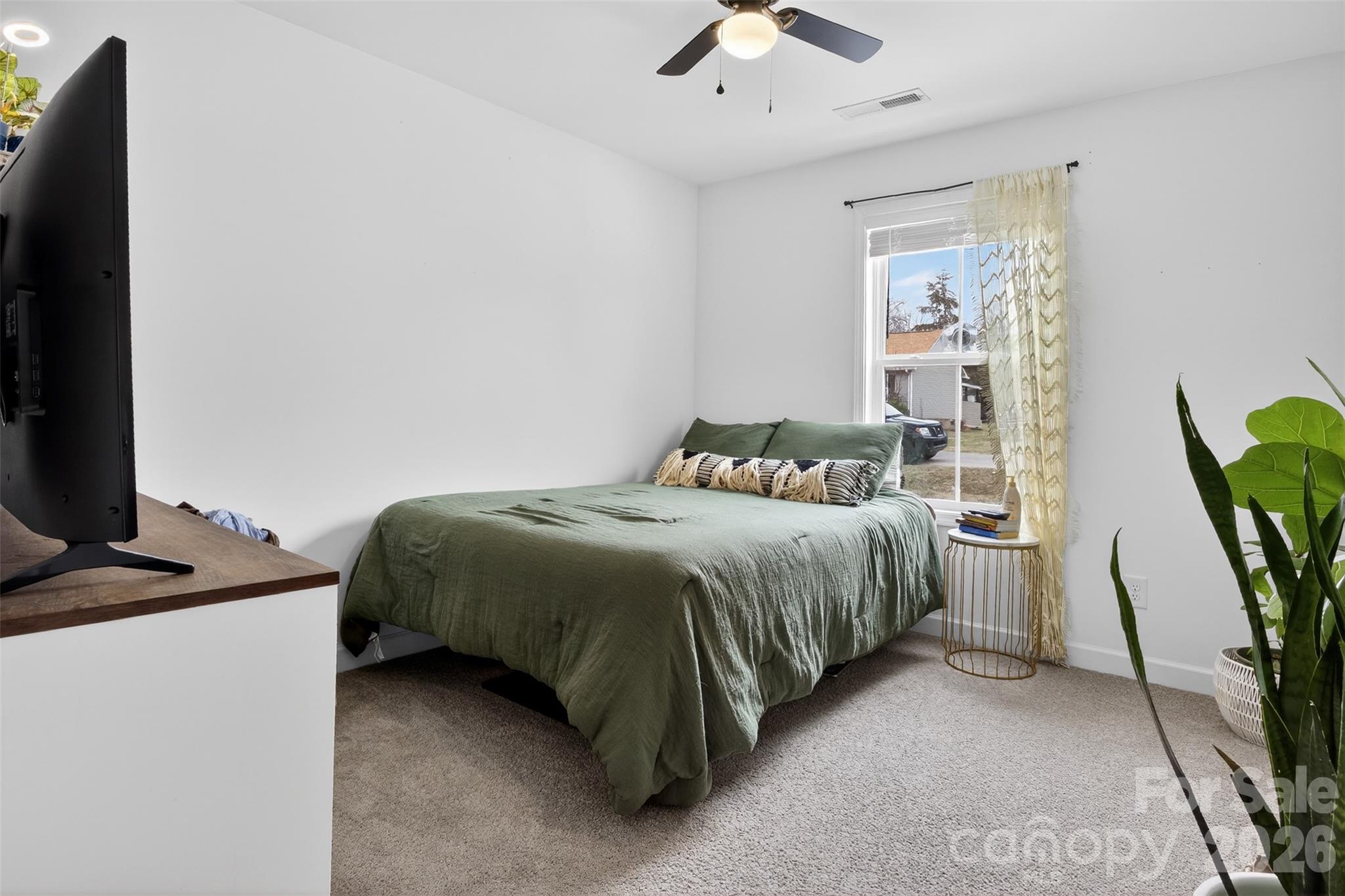 1526 Shepard Street Kannapolis, NC 28083 - Photo 29 of 40 a bedroom with a bed and a desk