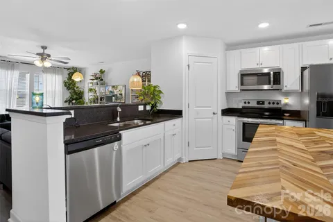 a kitchen with a table and chairs in it
