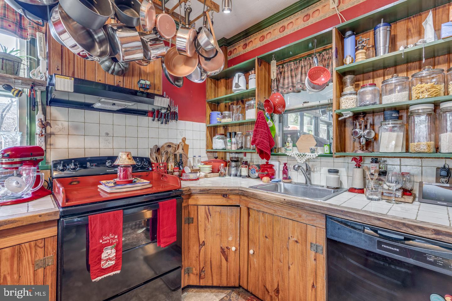 635 Laurel Street Delanco, NJ 08075 - Photo 9 of 45 a utility room with stainless steel appliances and wooden cabinets