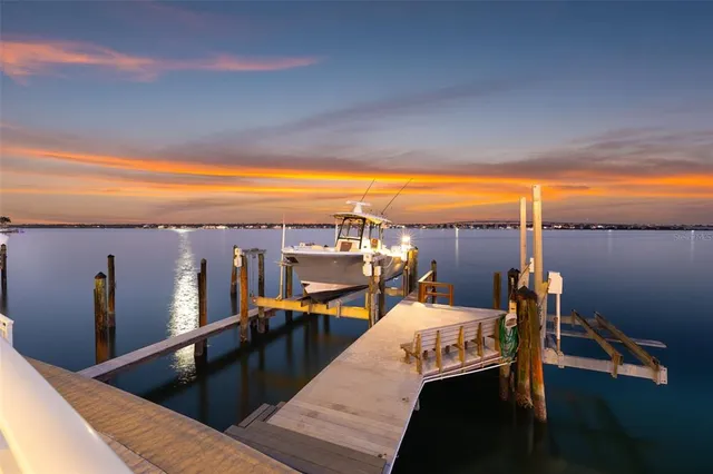 a front view of a house with a yard and a garage