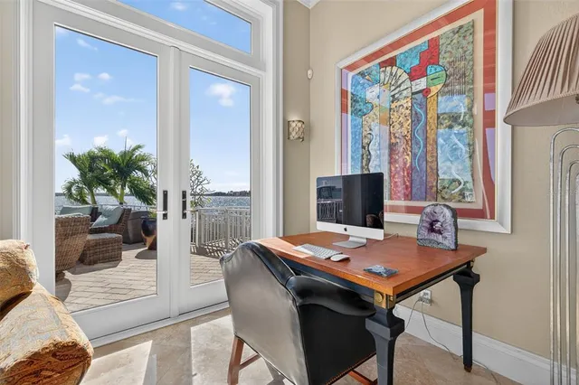a view of a dining room with furniture and a potted plant