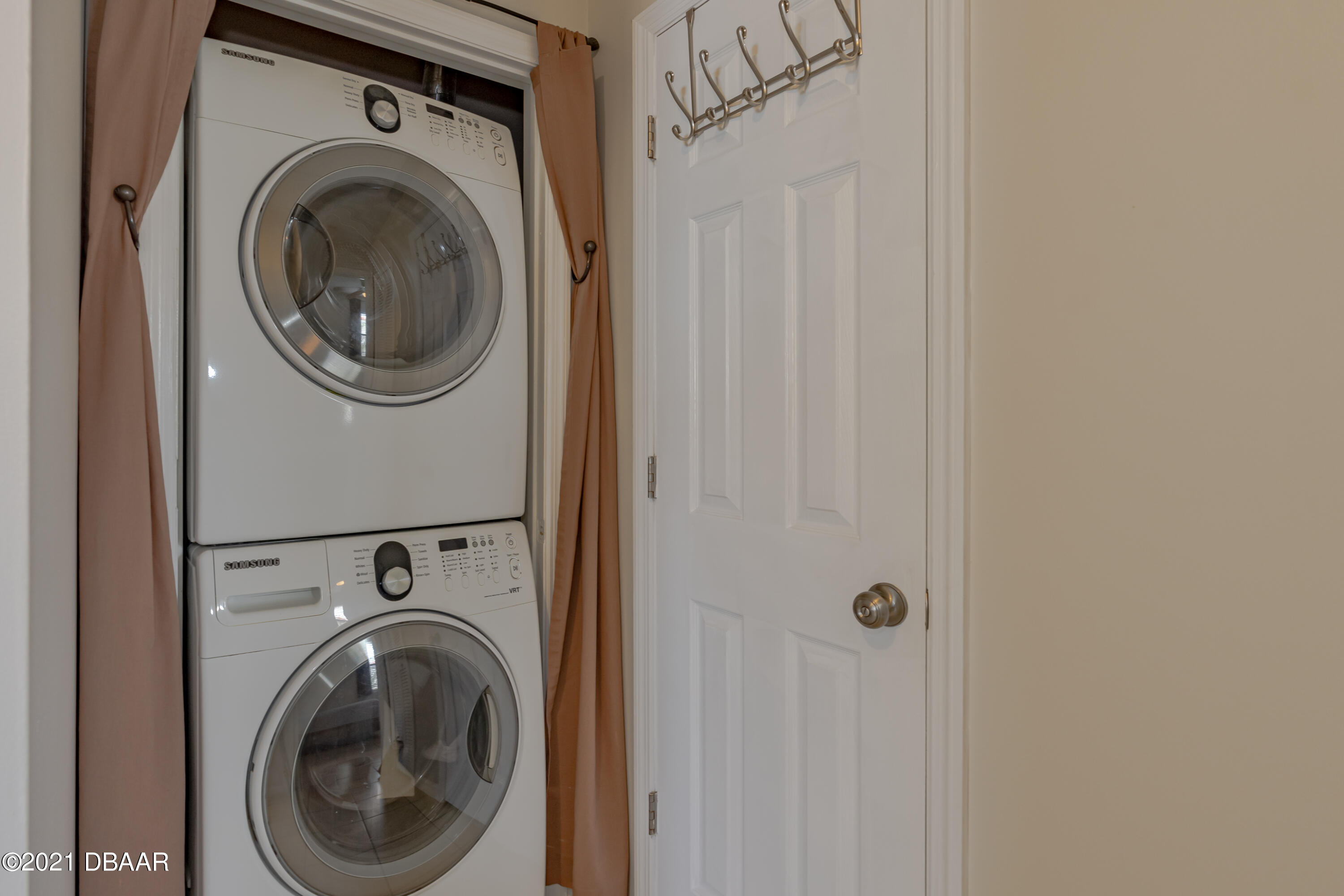 202 Northshore Drive, Unit B Ormond Beach, FL 32176 - Photo 15 of 25 a utility room with dryer and washer