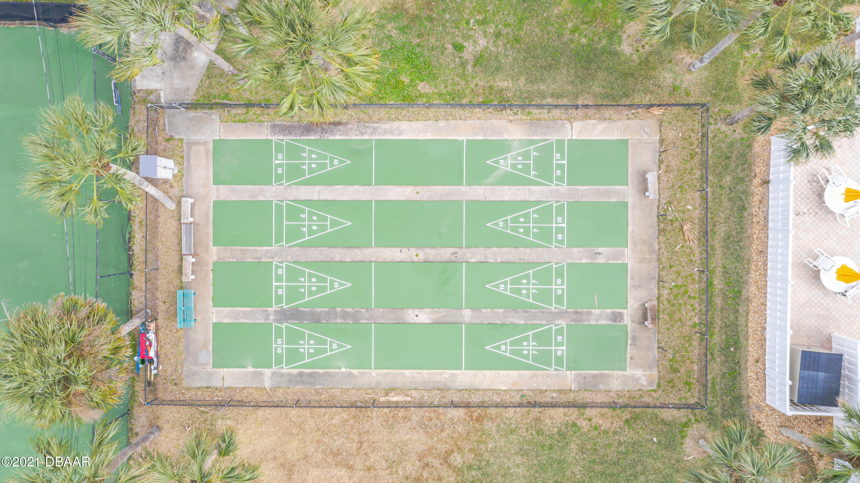 202 Northshore Drive, Unit B Ormond Beach, FL 32176 - Photo 24 of 25 a view of a door with a bench in front of building