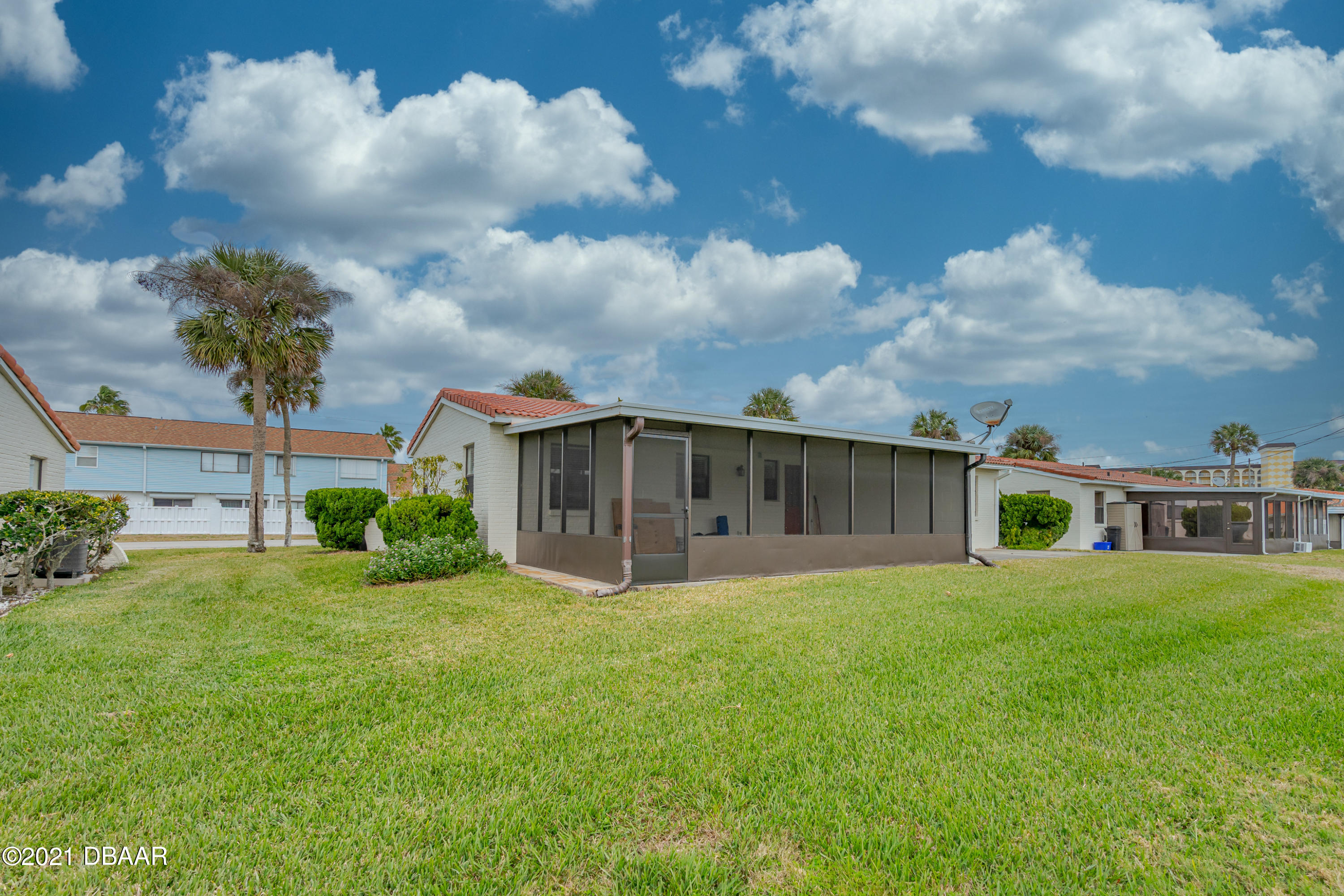 202 Northshore Drive, Unit B Ormond Beach, FL 32176 - Photo 3 of 25 a view of a house with a yard and sitting area