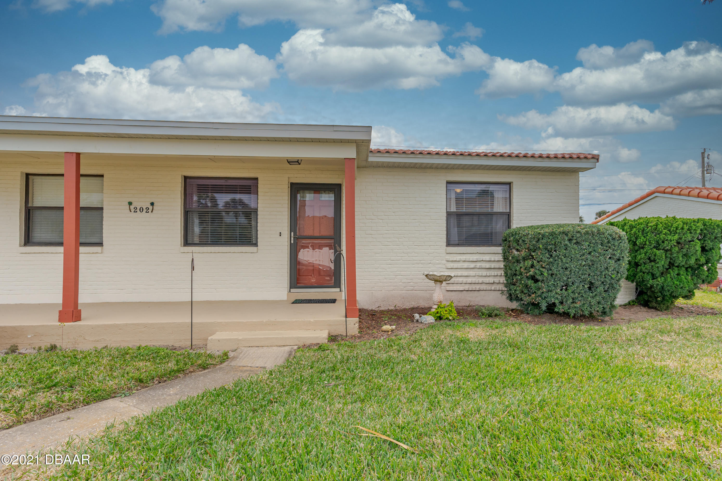 202 Northshore Drive, Unit B Ormond Beach, FL 32176 - Photo 5 of 25 a house view with a garden space